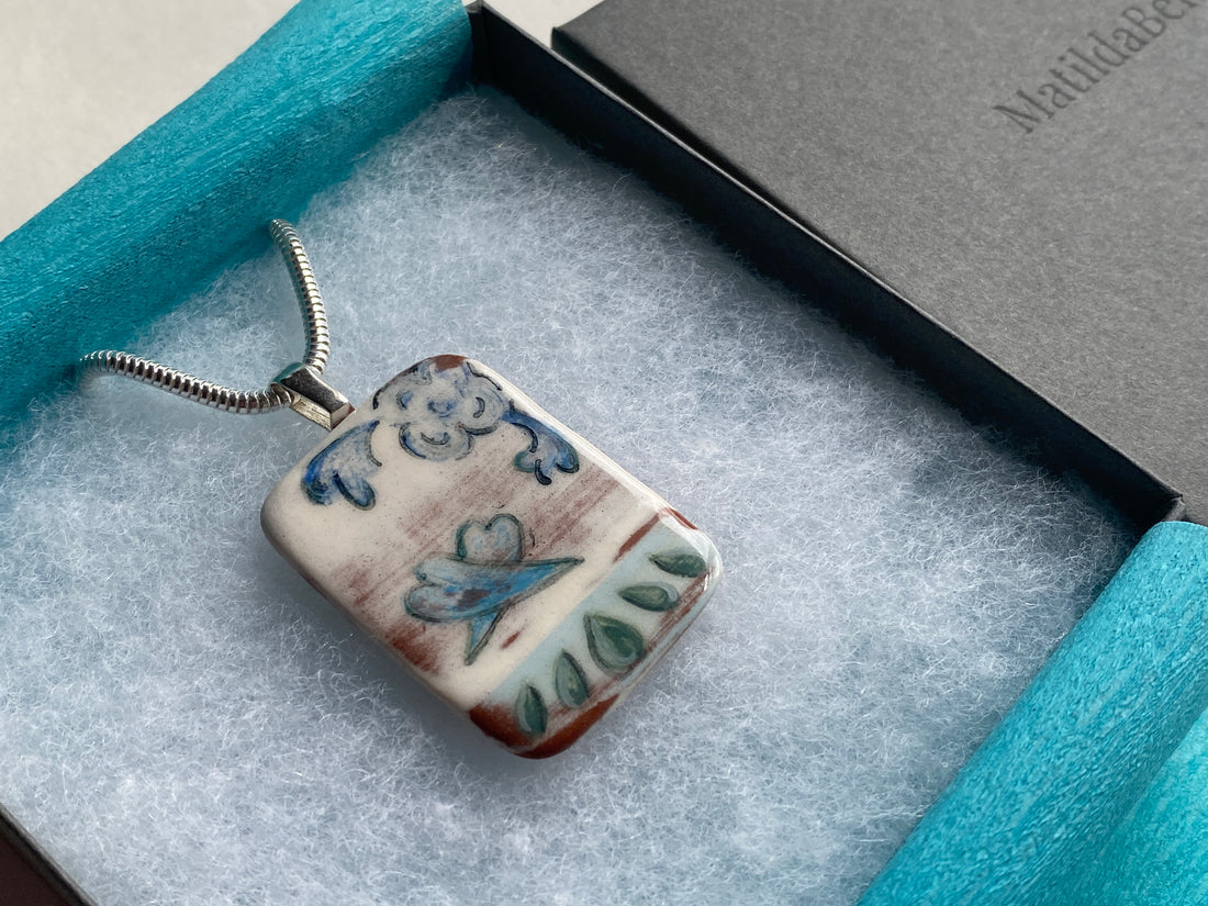 image of handmade ceramic pendant. Customer order made to celebrate a 20th wedding anniversary for customers wife.
