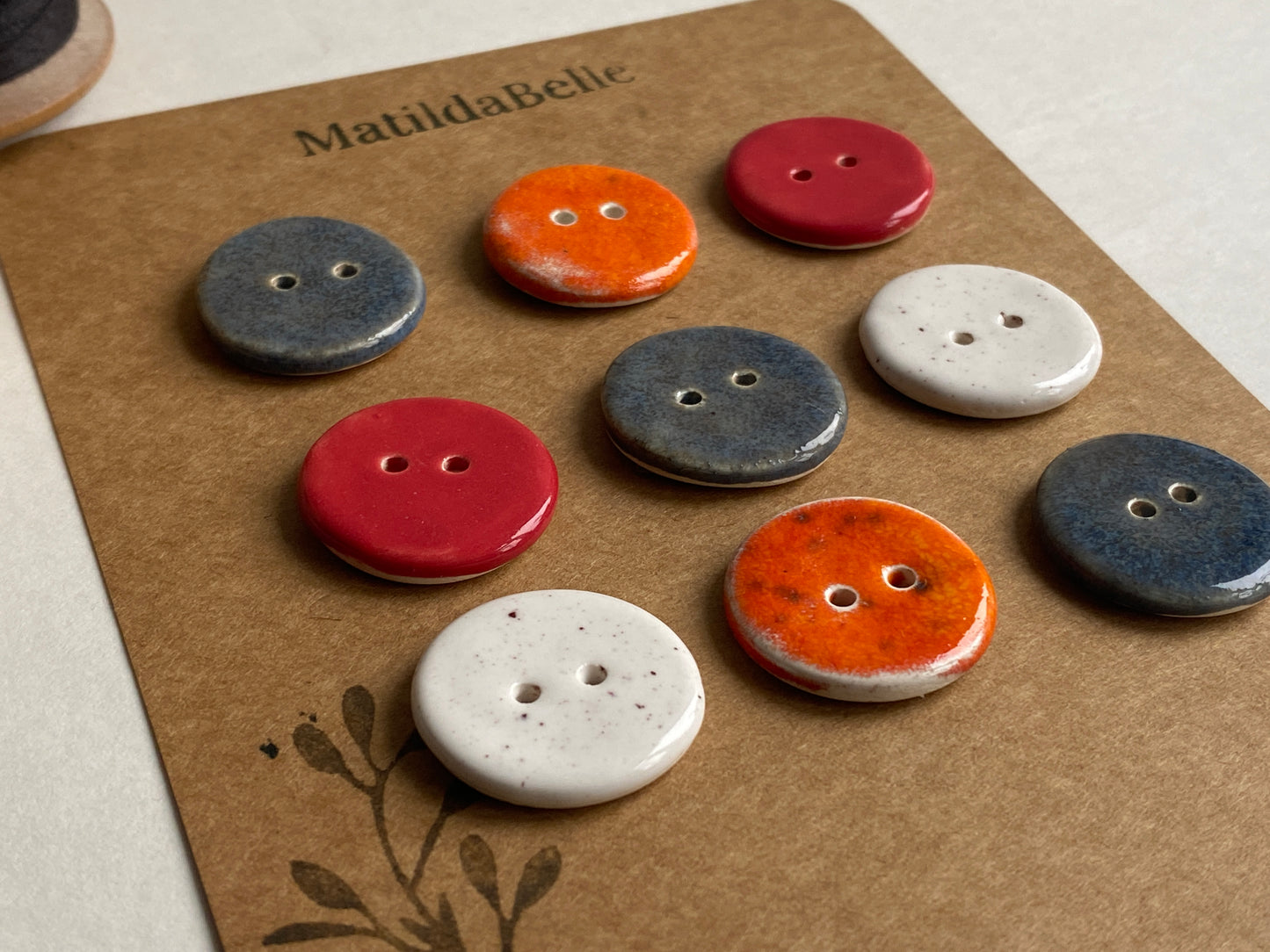 Buttons set of 9, 22mm rounds mixed colours