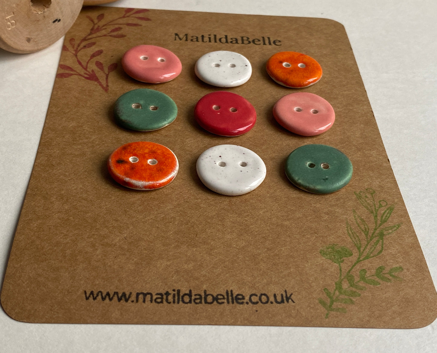 Buttons set of 9, 18mm rounds mixed colours
