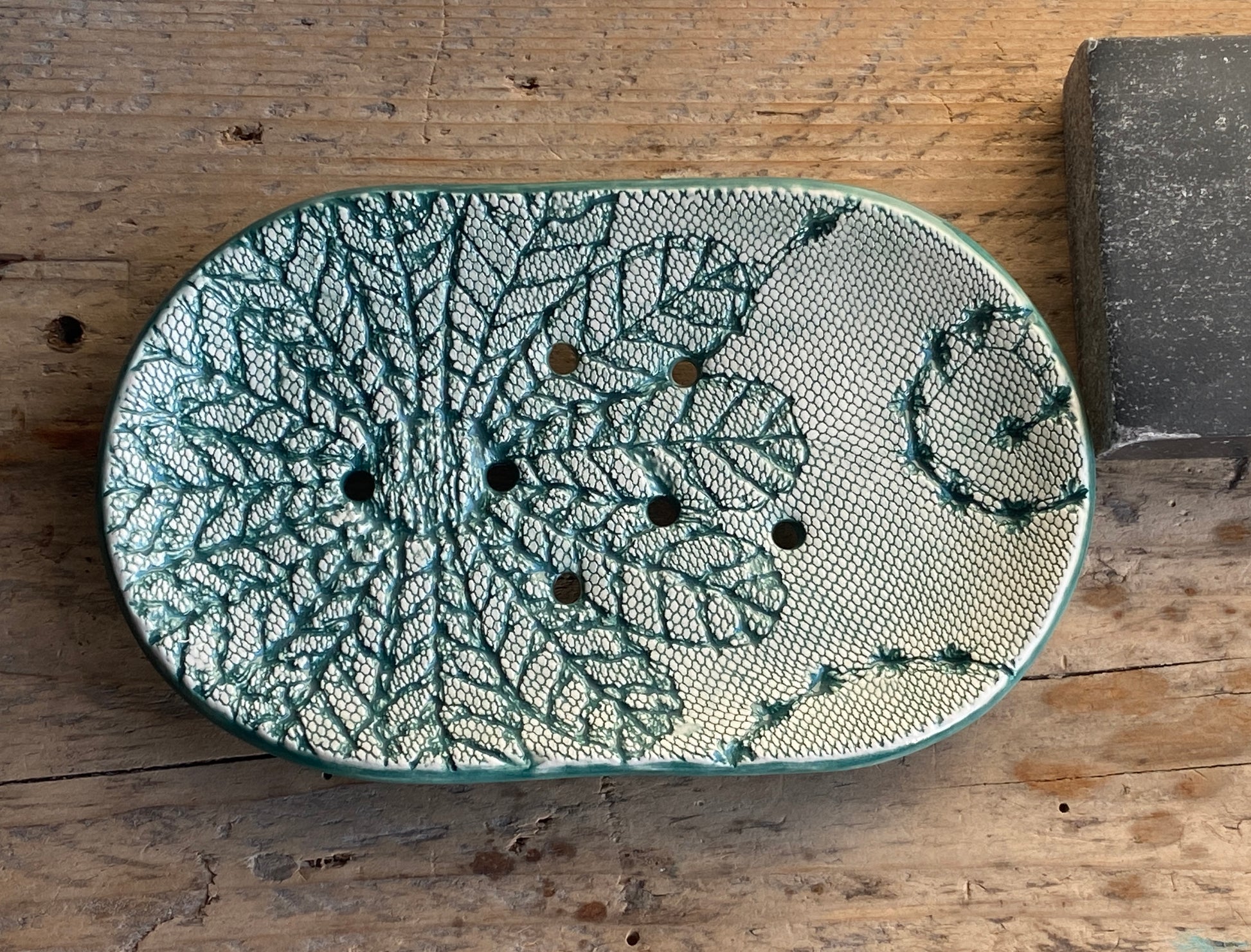 large oval handmade ceramic soap dish with crochet pattern glazed in green