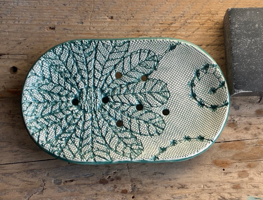 large oval handmade ceramic soap dish with crochet pattern glazed in green