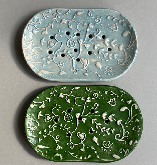 Choice of two handmade ceramic soap dishes with drain holes. Choice of forest green or baby blue in whimsical botanical pattern