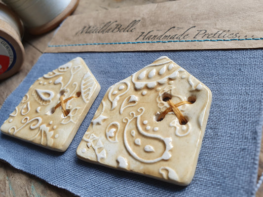 Two Ceramic Paisley HouseCeramic Buttons in Ochre