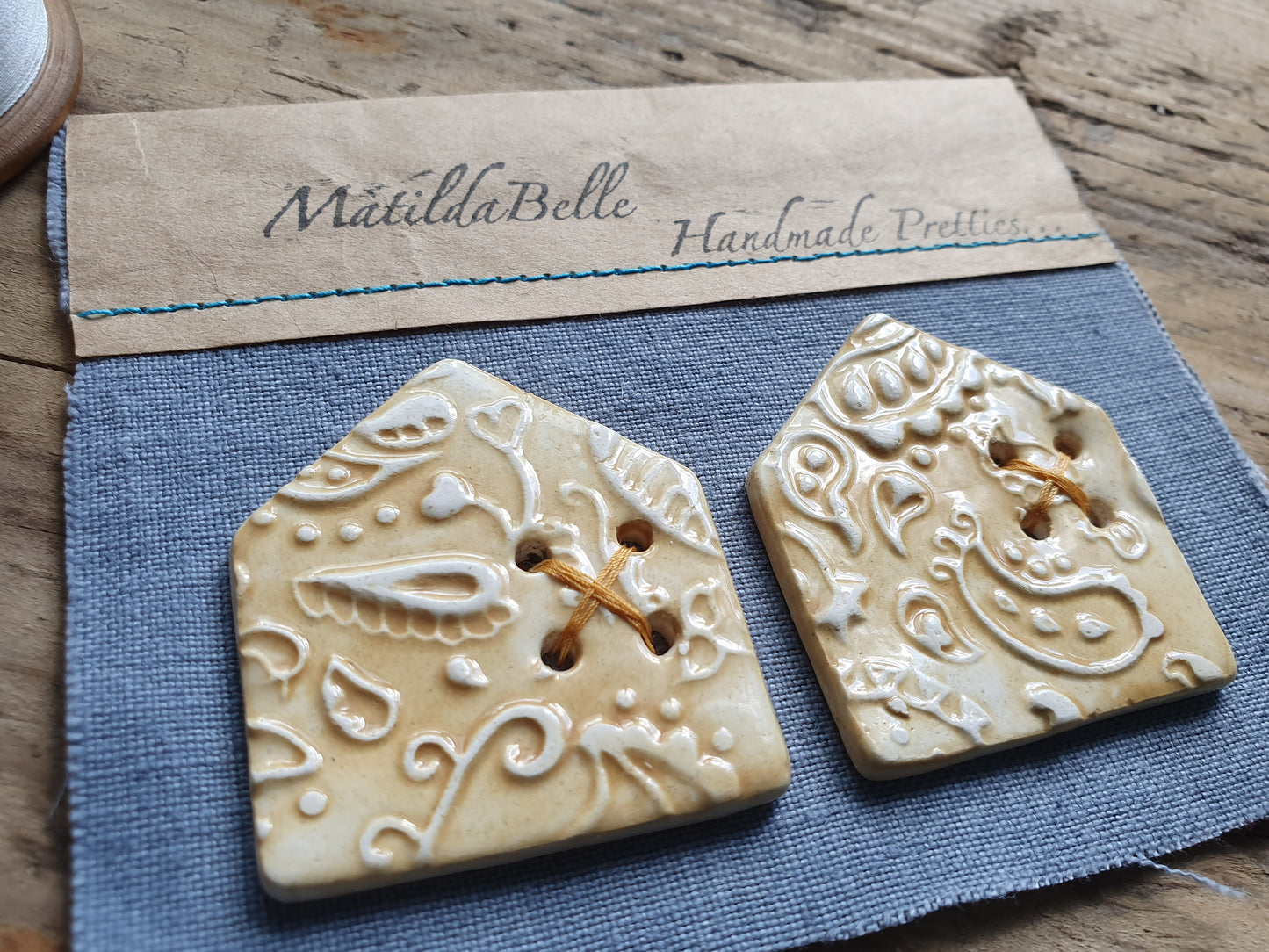 Two Ceramic Paisley HouseCeramic Buttons in Ochre