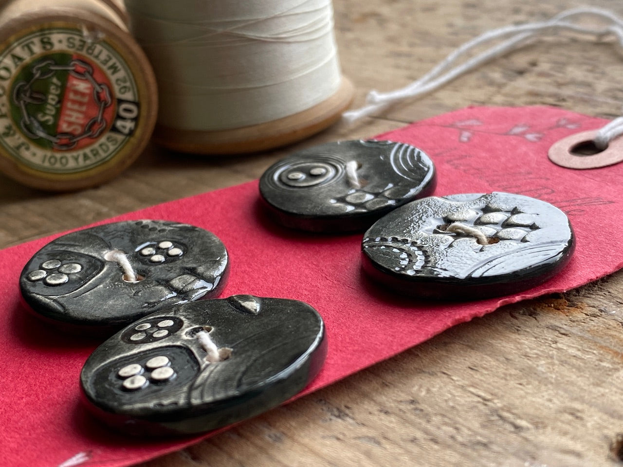 Set of Four Black handmade Ceramic Round Buttons 28mm