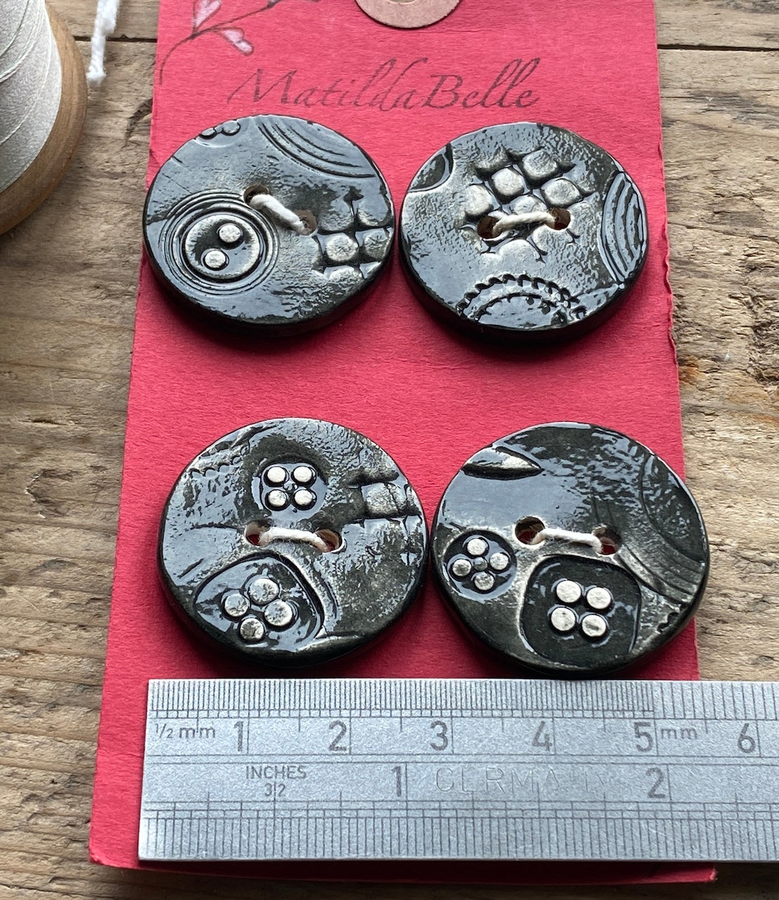Set of Four Black handmade Ceramic Round Buttons 28mm