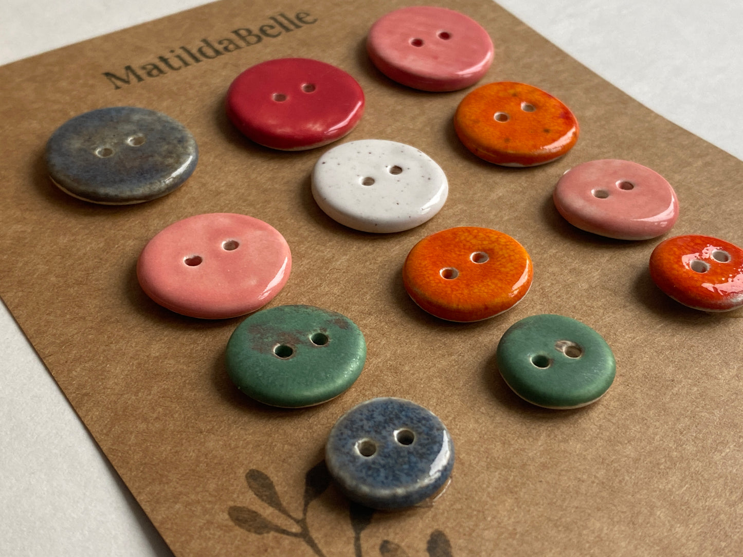 Buttons set of 12, 14mm-23mm rounds mixed colours