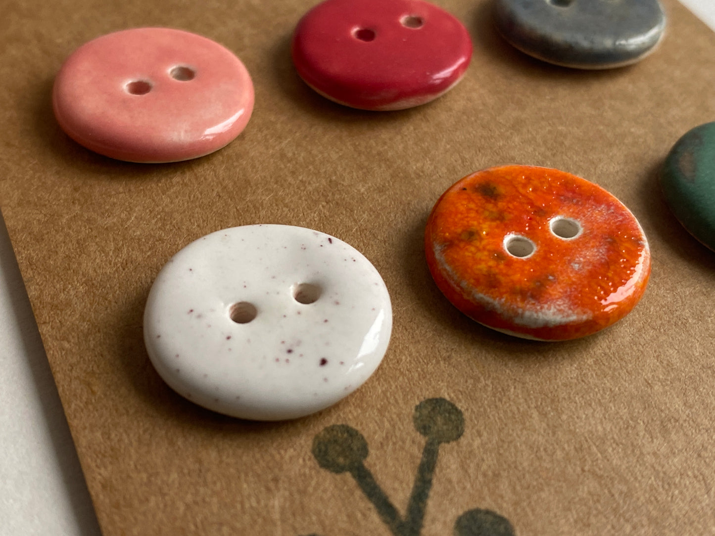 Buttons set of 12, 14mm-23mm rounds mixed colours