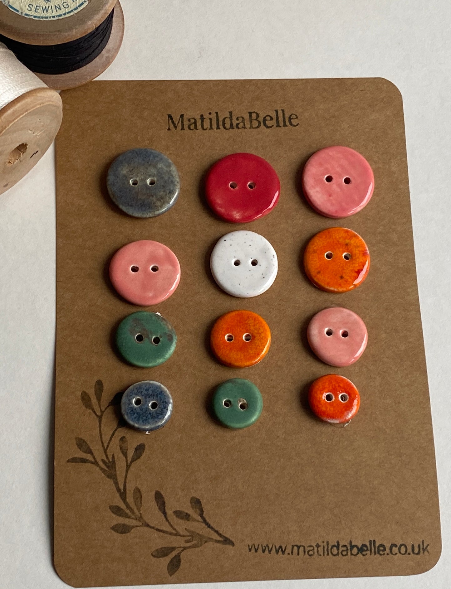 Buttons set of 12, 14mm-23mm rounds mixed colours